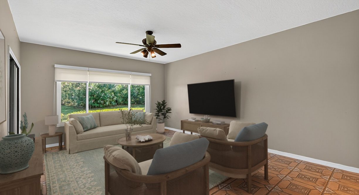 Virtually staged Livingroom photo for waterfront condo for sale at 6165 S Mirror Lake Drive #106 Sebastian, FL 32958