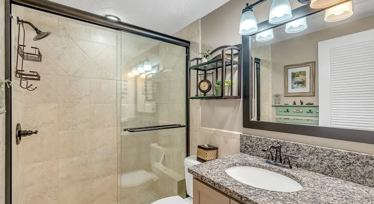 Restroom photo of Virtually staged Livingroom photo for waterfront condo for sale at 6165 S Mirror Lake Drive #106 Sebastian, FL 32958